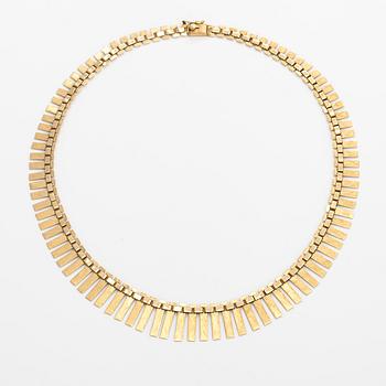 A 14K gold necklace. Import marked Koruteollisuus Tillander, Helsinki 1965.