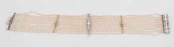 A cultured saltwater pearl and diamond choker necklace. Total carat weight 1.00 ct.