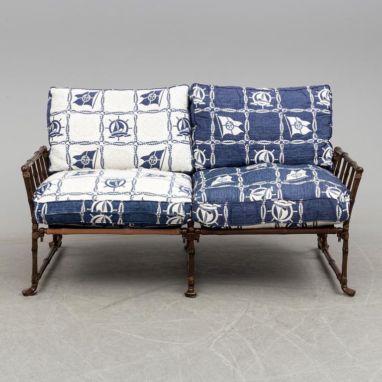 A contemporary bamboo imitating garden sofa.
