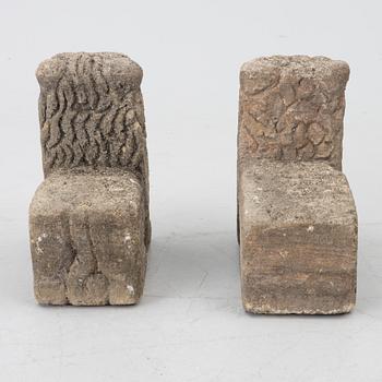 A set of two lion garden sculptures.