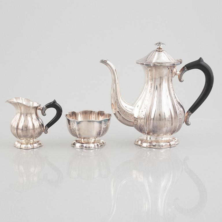 A silver coffee pot, creamer and sugarbowl, Swedish import marks, JL Hultman, circa mid-20th century.