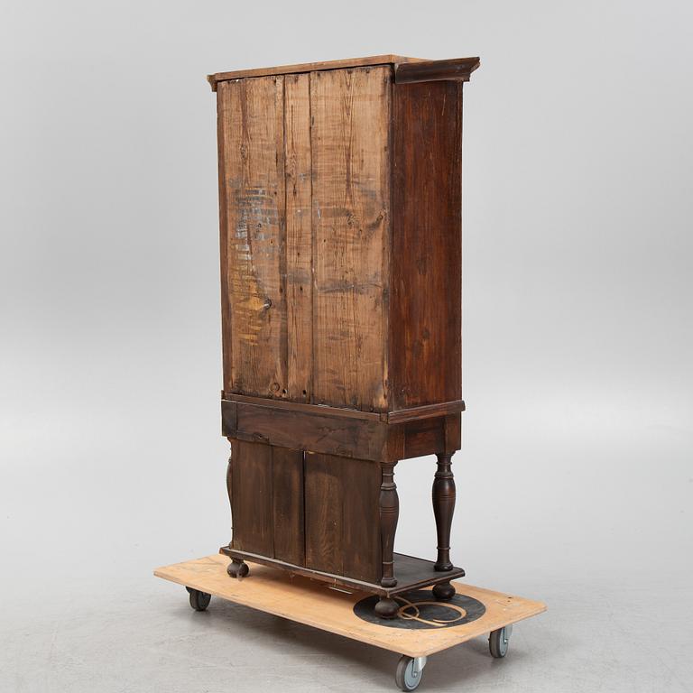 A Baroque cabinet on a later stand, early 18th Century.