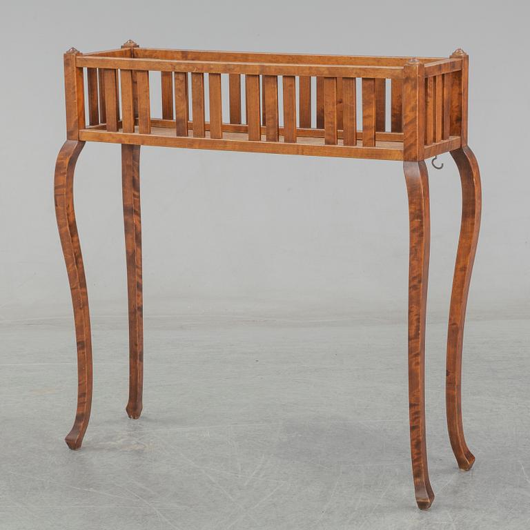 A stained birch plant stand, first half of the 20th Century.