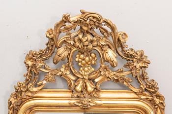 A bronzed Neo Rovovo mirror and table later part of the 19th century.