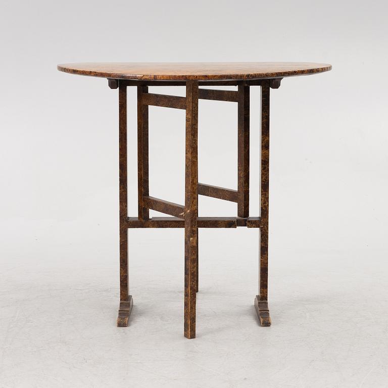 A folding table, 19th Century.