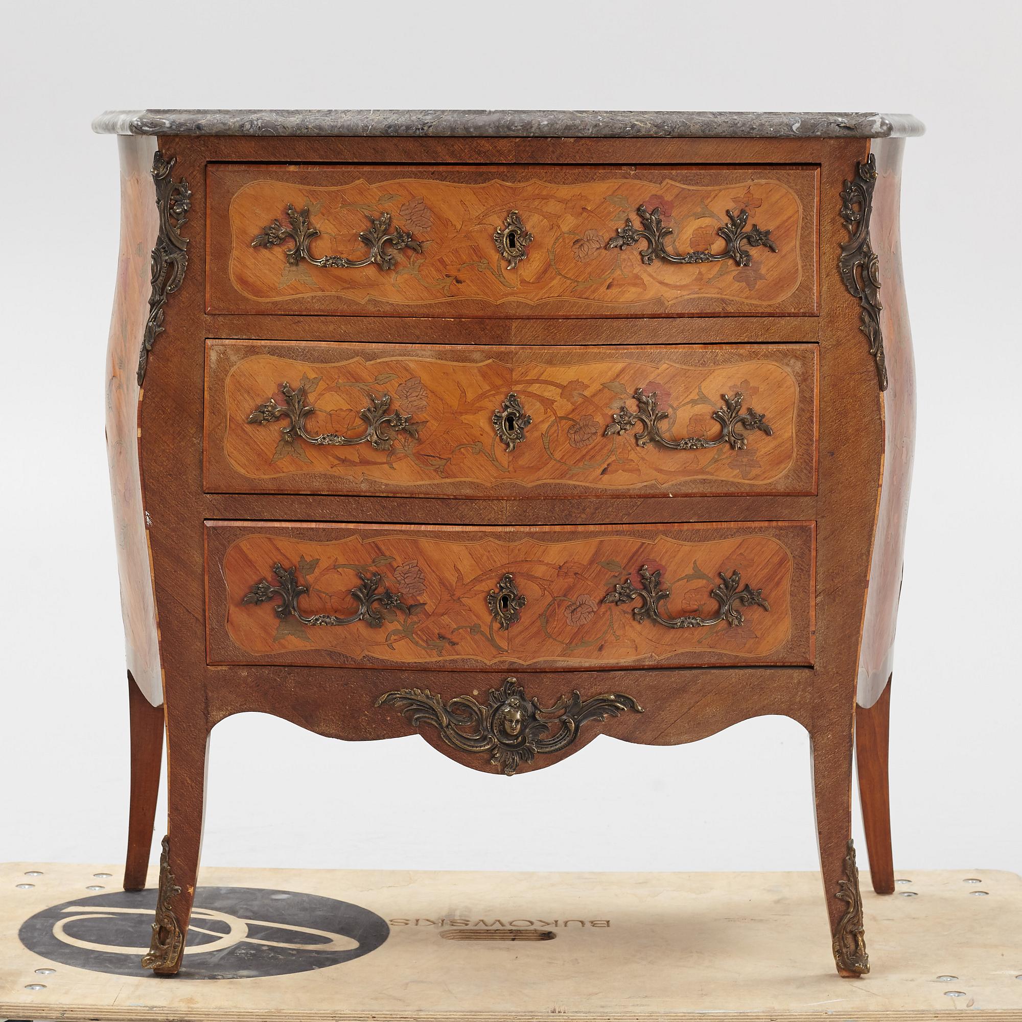 A Louis XV-style marquetry commode, first part of the 20th century.