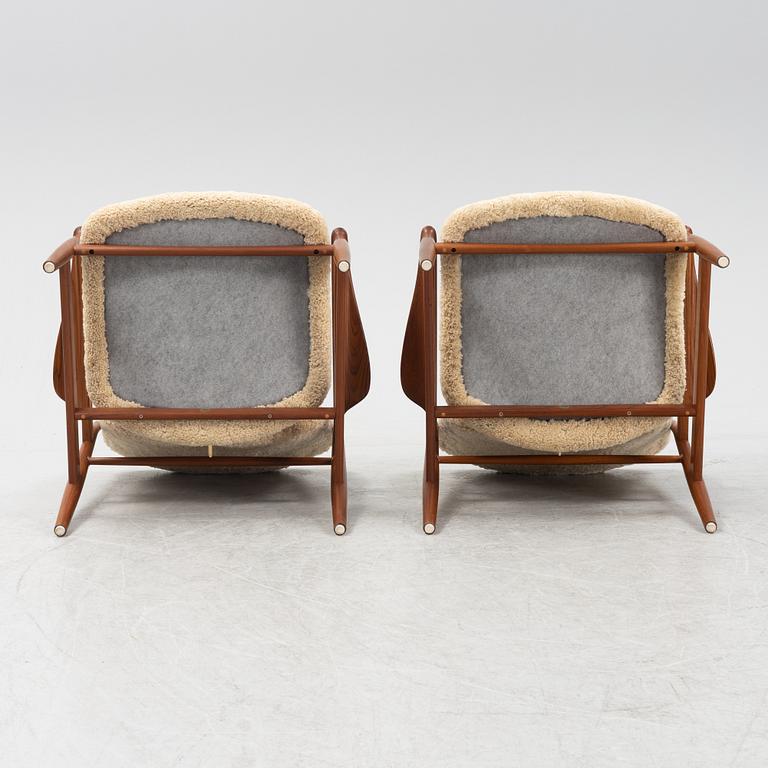 A pair of model FD 136 easy chairs with new sheepskin upholstery by Finn Juhl for France & Son, designed 1958.