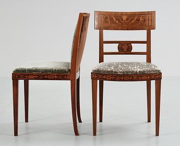 Two + two Swedish wooden chairs with stylized inlays,