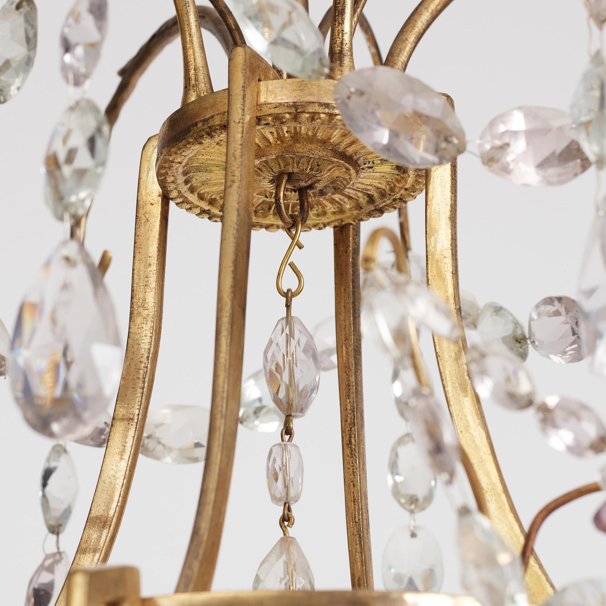 A German Louis XVI ormolu and cut-glass nine-light chandelier attributed to Johann Christoph Ermisch, late 18th century.
