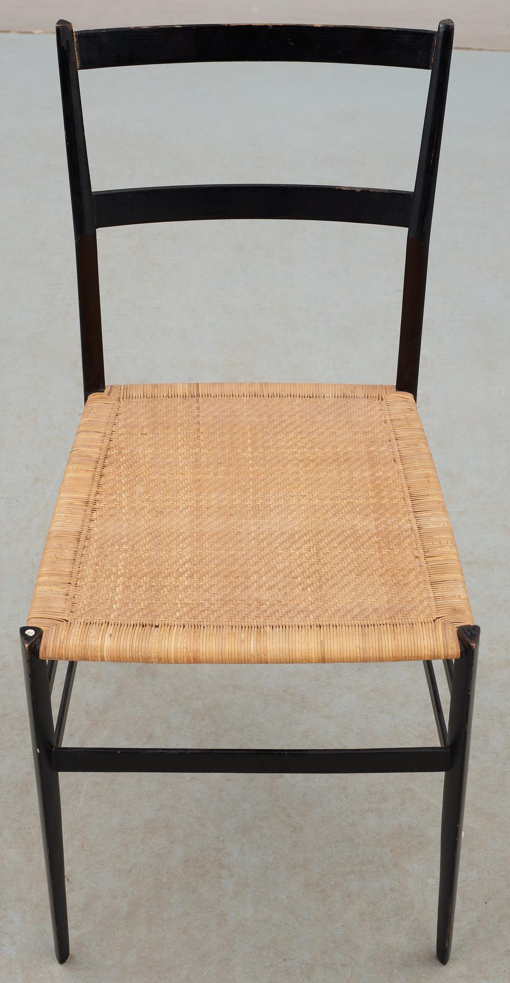 A Gio Ponti 'Superleggera' chair, Cassina, Italy, black painted ash with ratten seat.