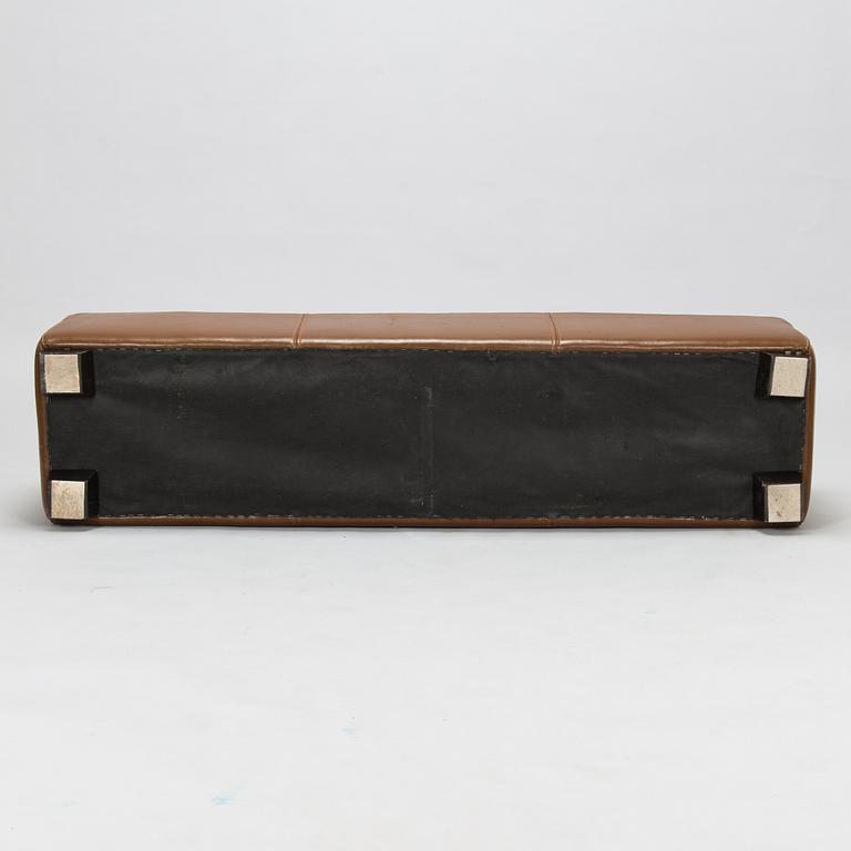 A leather-upholstered bench from Industria Divani e Poltrone, Italy.