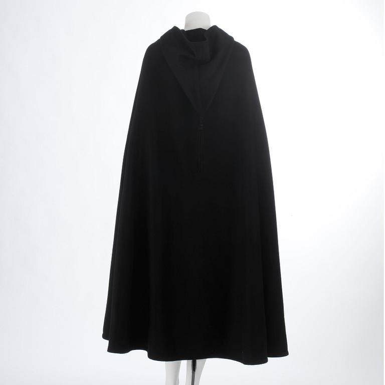 YVES SAINT LAURENT, a black wool cape with hood. .