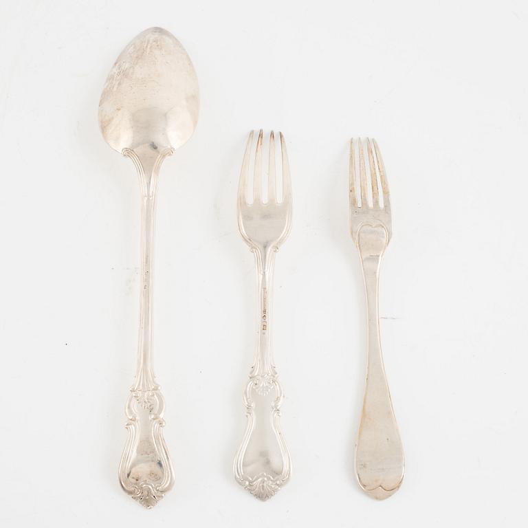 A group of eleven Swedish silver forks and a spoon, 19th Century.