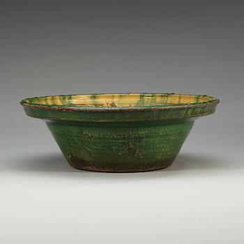 A large green and yellow glazed dish, 18th Century.