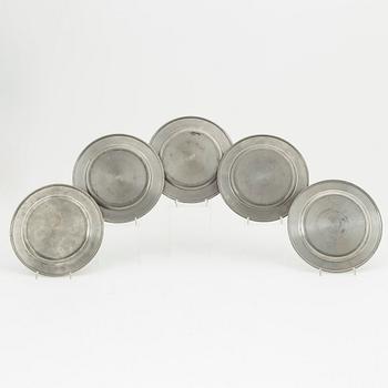 Five pewter plates, of which four Firma Svenskt Tenn, Stockholm.