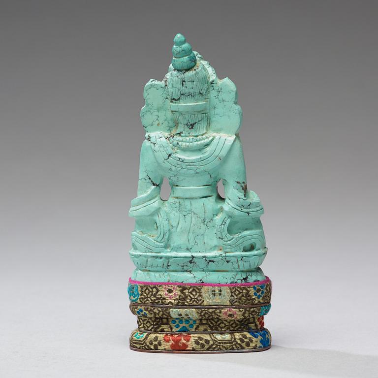 A turquoise figure of a bodhisattva, Tibet, late 19th Century.