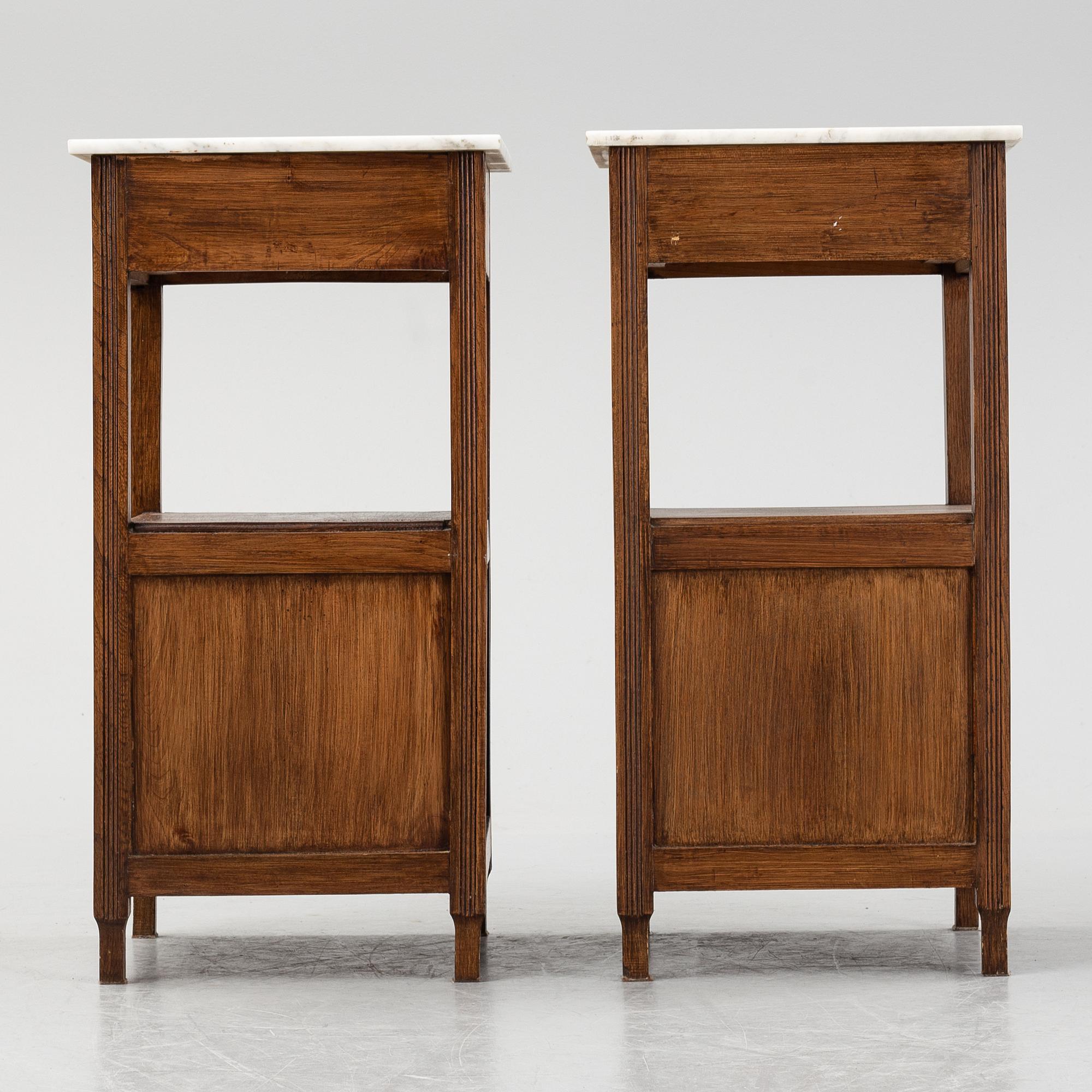 A pair of early 20th Century bedside tables.