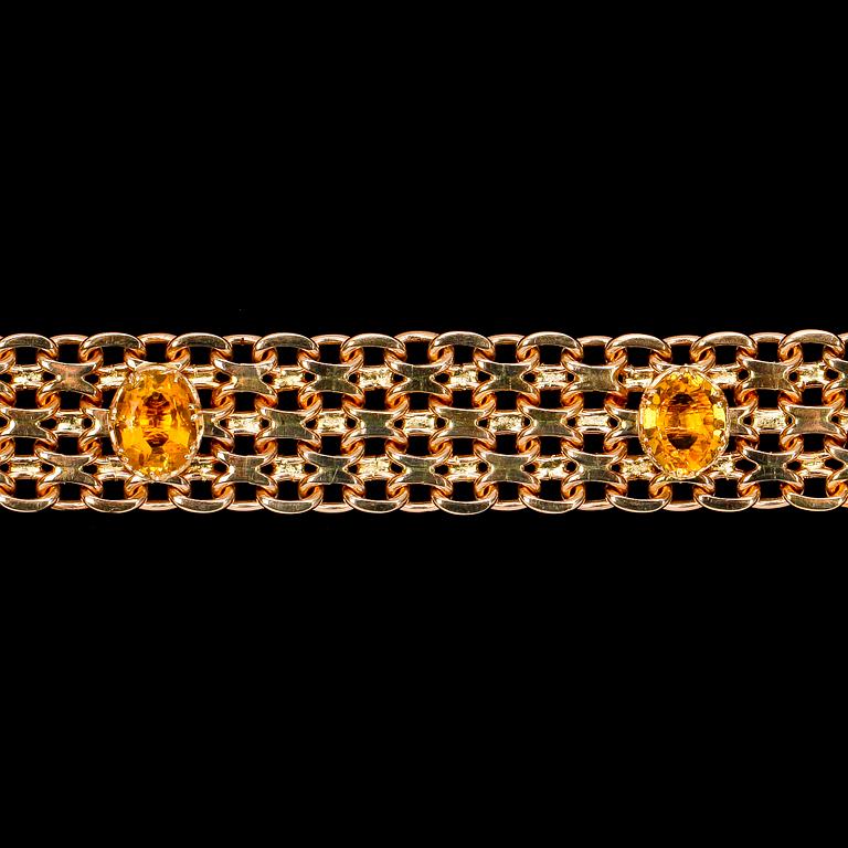ARMBAND, x-länk med infattade citriner. Vikt 80 g.