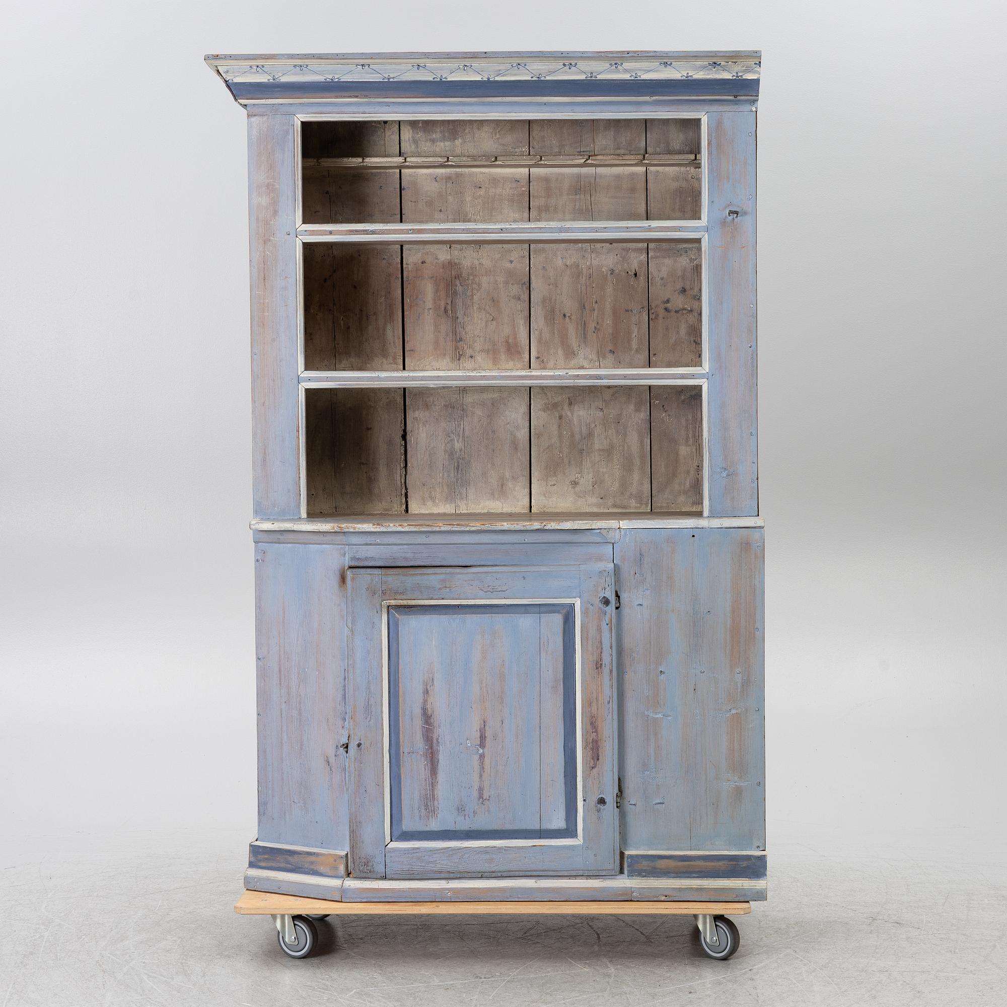 A painted folk-art cupboard, early 19th century.
