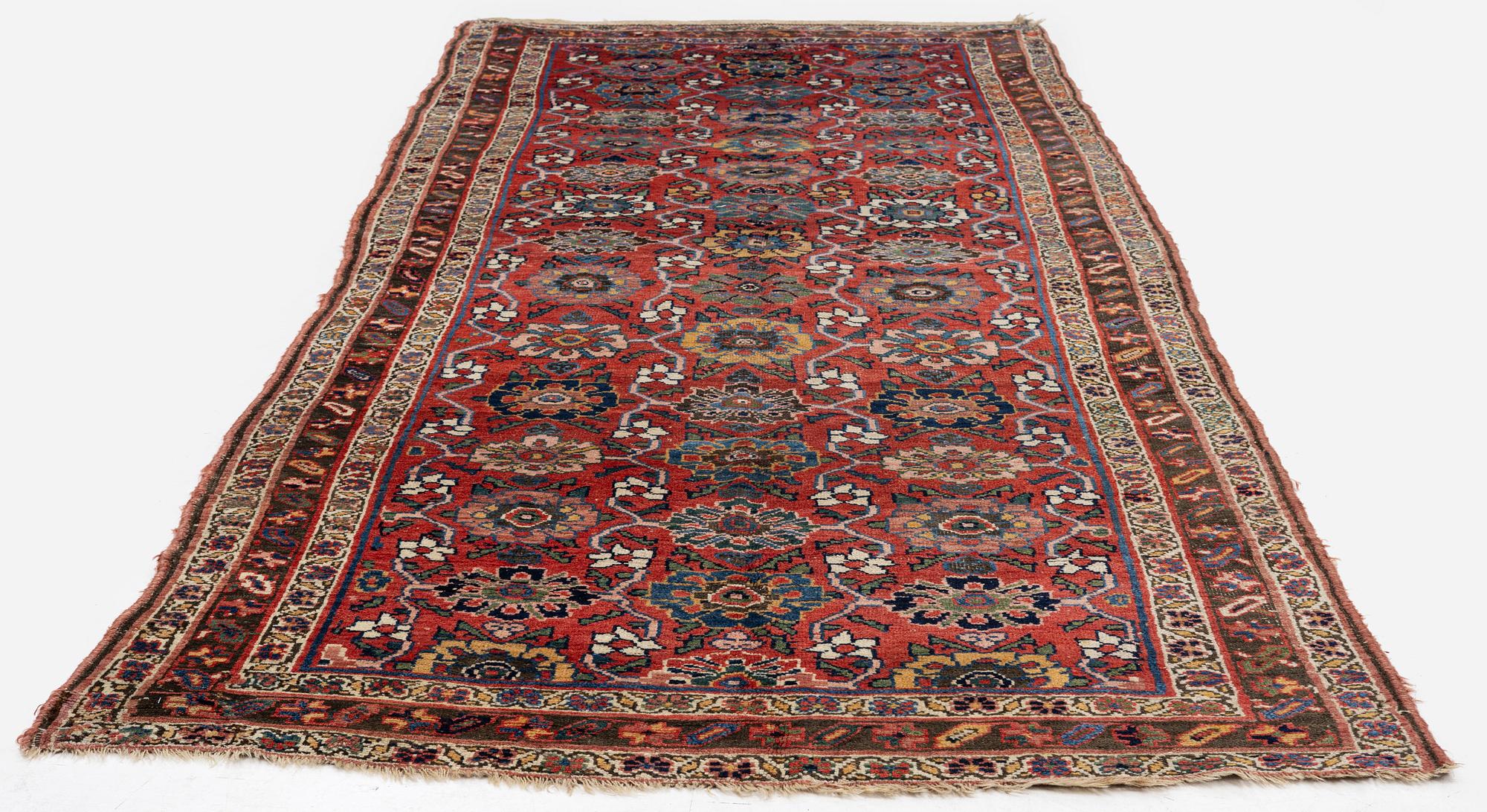 An antique Bidjar carpet, West Persia, c. 352 x 148 cm.
