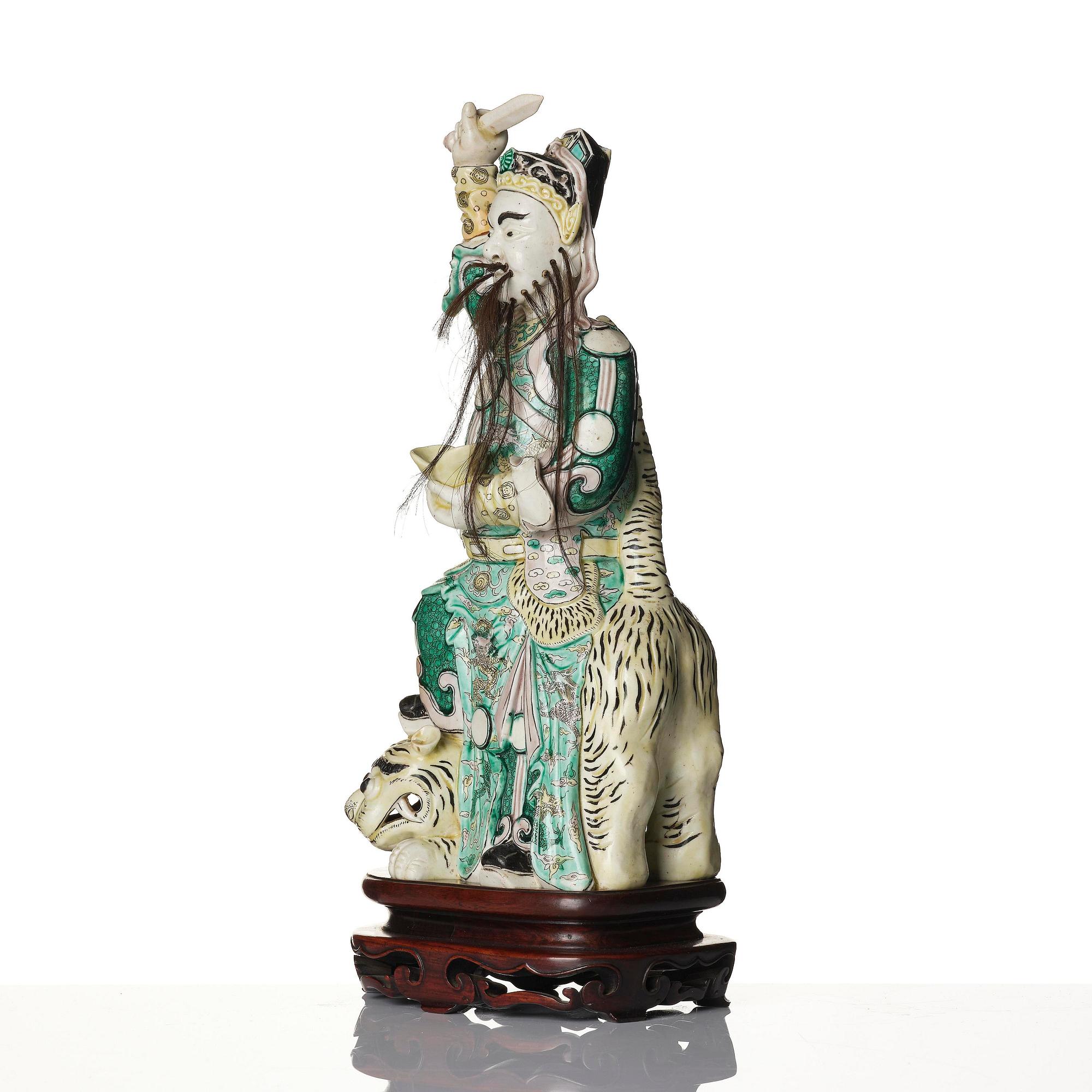 A famille verte bisquit figure of a warrior, Qing dynasty, 19th century.