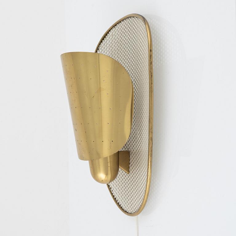 Swedish Modern, a brass wall lamp, 1940-50s.