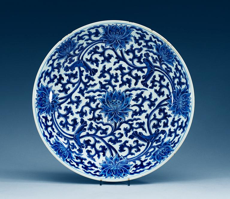 A large blue and white charger, Qing dynasty, with Kangxis six character mark and period (1662-1722).