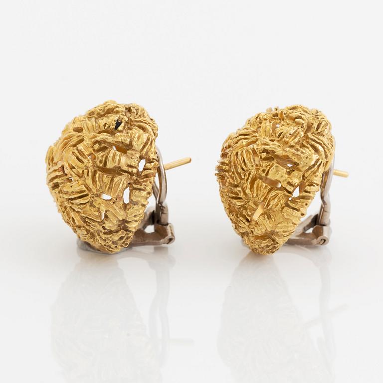 A pair of 18K gold earrings.