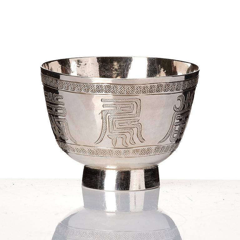 A set of six silver cups with holders, China, 20th century.