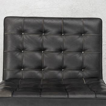 Ludwig Mies van der Rohe, a pair of "Barcelona" lounge chairs, Knoll.
