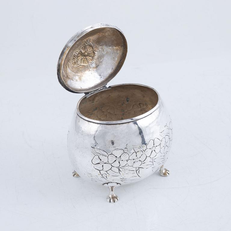 A silver sugar box, early 20th Century.