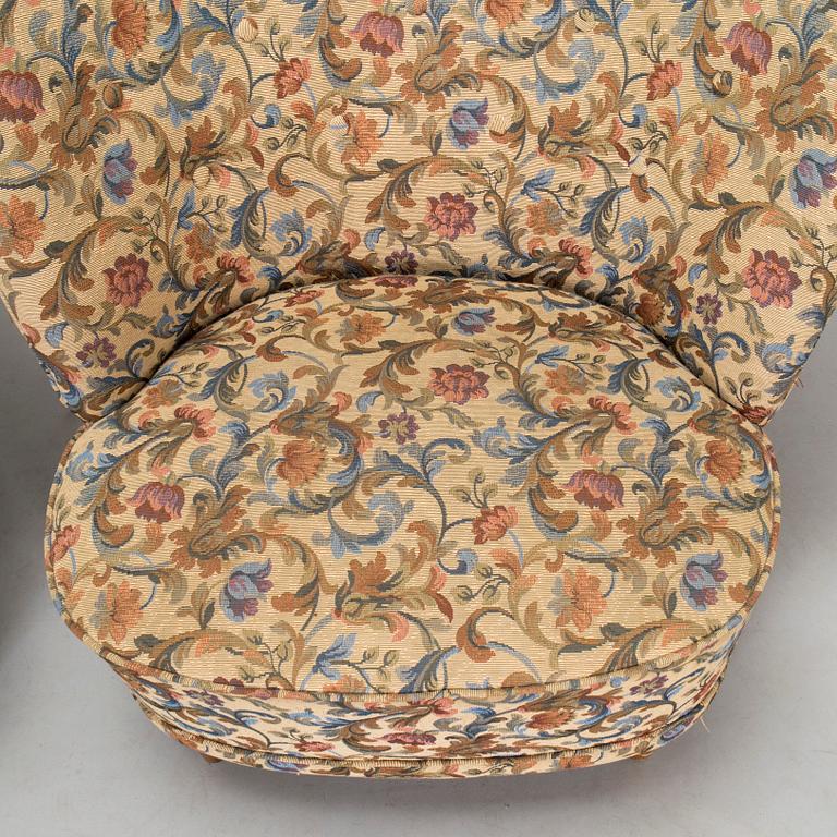 A pair of mid-20th-century armchairs.