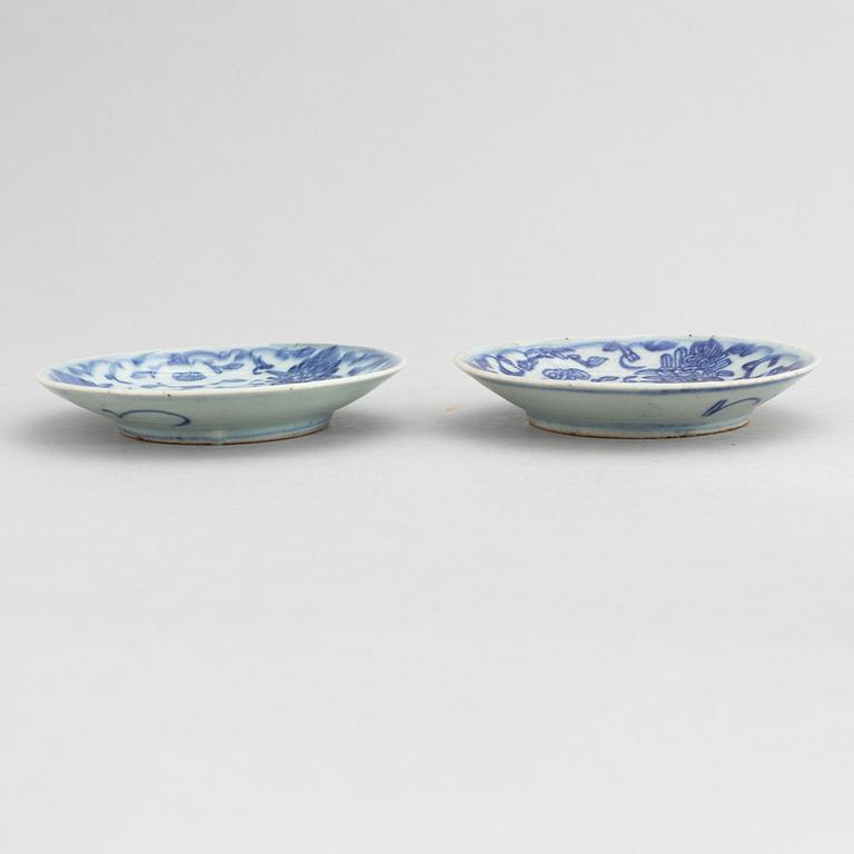 A set of 12 similar Chinese blue and white porcelain small dishes, late Qing dynasty, around the year 1900.