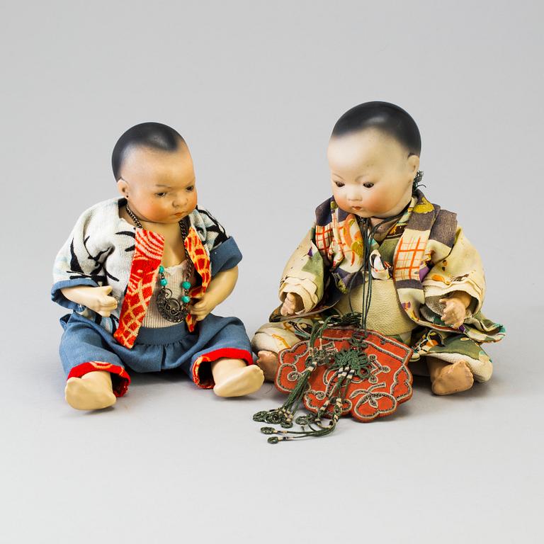 Two oriental bisque head baby dolls by Armand Marseille and Heubach Köppelsdorf, Germany, early 20th century.