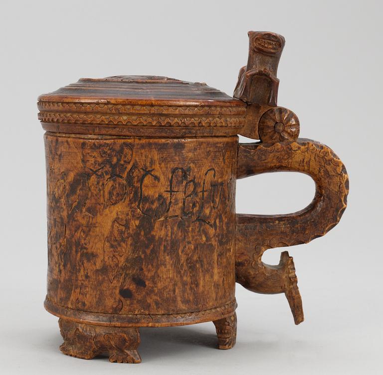 A Norwegian wooden tankard, dated 1741.