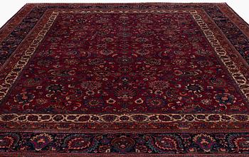 A Mashad carpet, signed Saber, c. 459 x 348 cm.