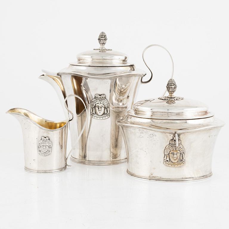 A Swedish silver coffee pot, a sugarbox and a creamer, including Gustaf Hamnqvist, Åmål 1809.