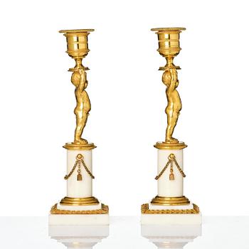 A pair of late Gustavian ormolu and white marble candlesticks, Stockholm, late 18th century.