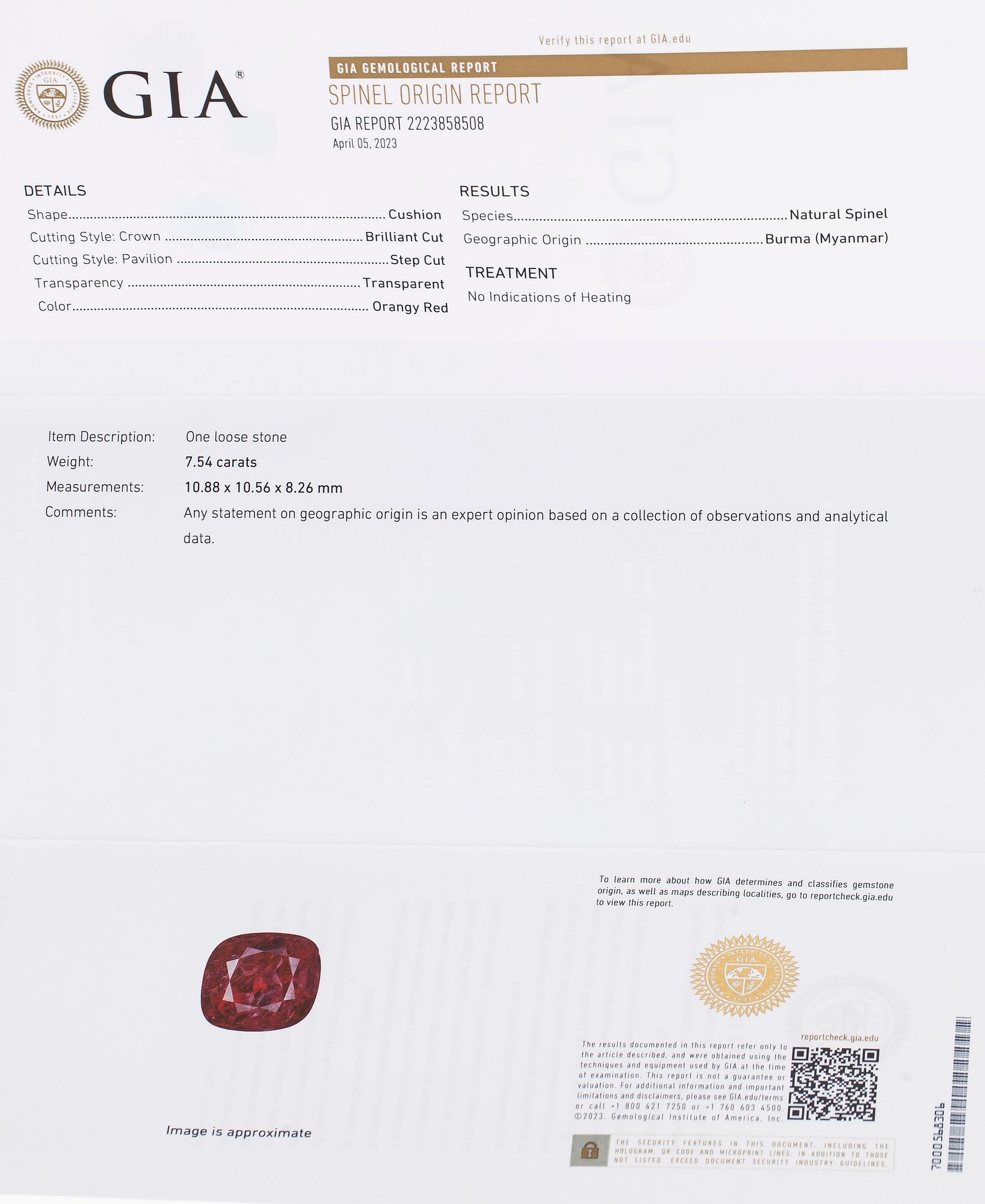 A platinum ring with spinel and brilliant cut diamonds.