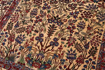 A semi-antique Qum carpet, Central Persia, c. 312 x 215 cm.