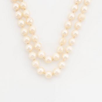 Two strands cultured pearl necklace,  clasp 18K white gold with sapphires and brilliant cut diamonds.