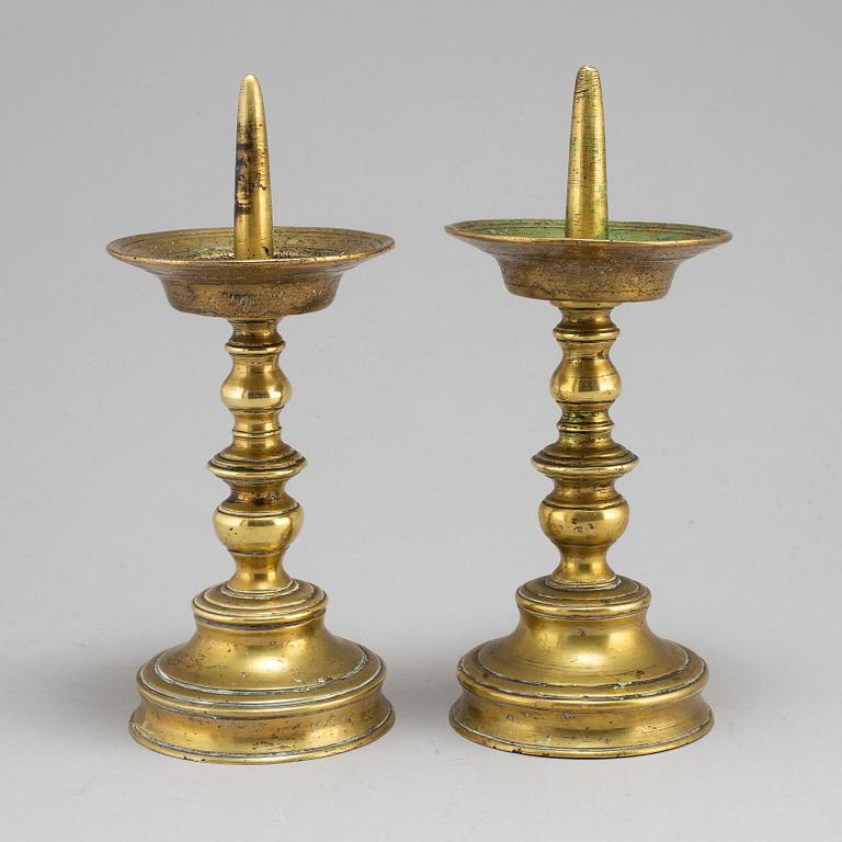 A pair of Baroque 18th century brass candlesticks.