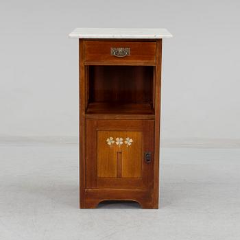 An early 20th century 'Jugend' style bedside cabinet.