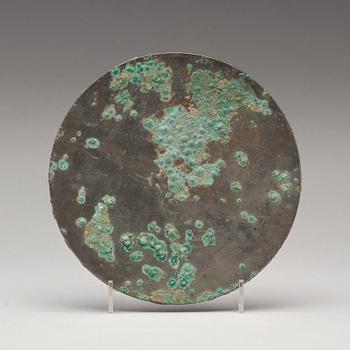 A bronze mirror, Han dynasty (206 B.C - 220 A.D).