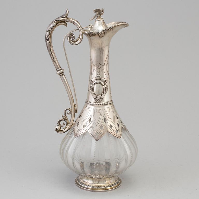 A first half of the 20th century silver and glass wine jug.