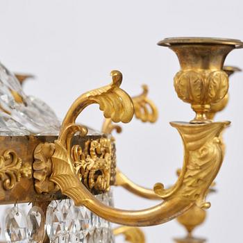 An ormolu and cut glass sixteen-branch Empire chandelier, Paris, early 19th century.
