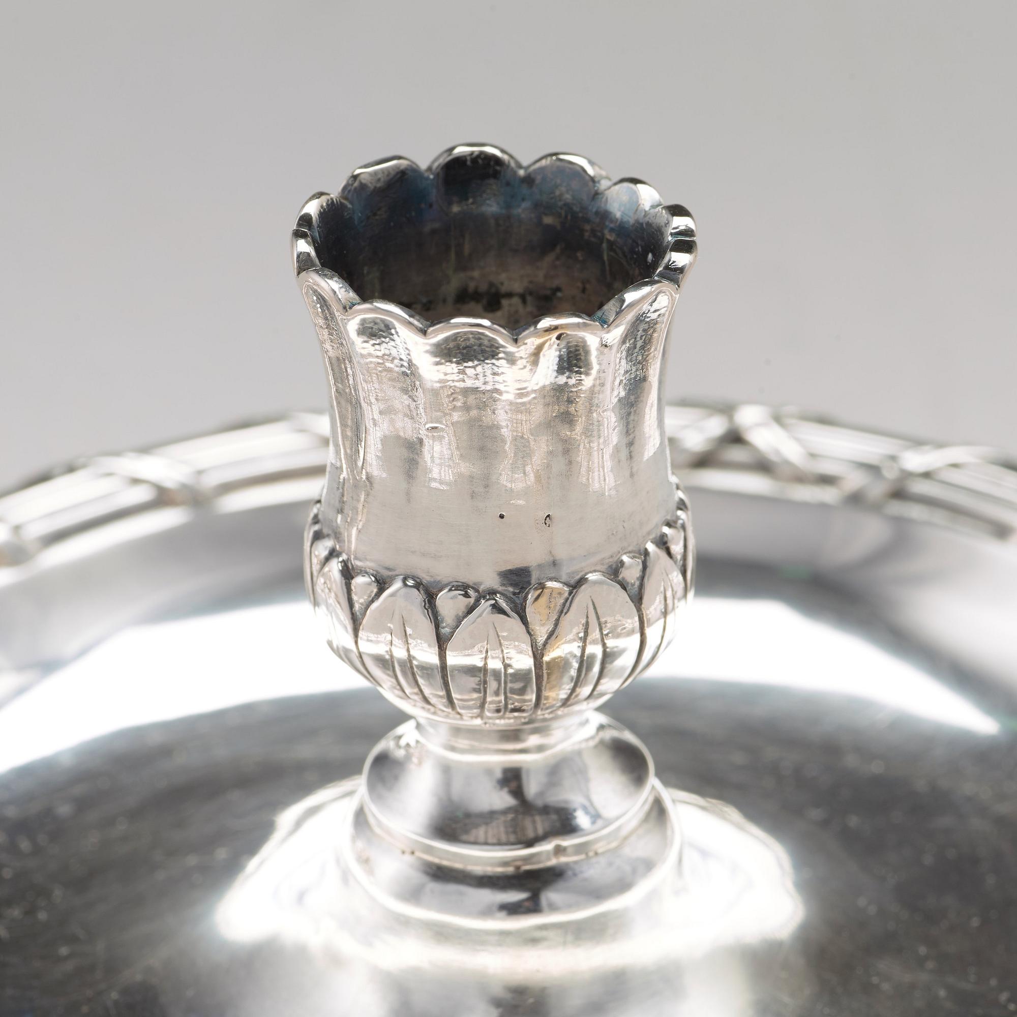 A pair of Swedish 18th century silver chamber-candlesticks, mark of Isak Sauter, Stockholm 1772.