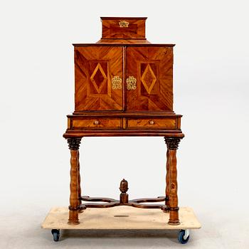 A first half of the 18th century walnut cabinet.