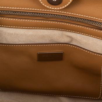 Prada, a leather handbag.