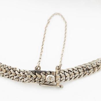 Ladies’ wristwatch in platinum and 18K white gold with old-cut diamonds and sapphires, Art Deco.